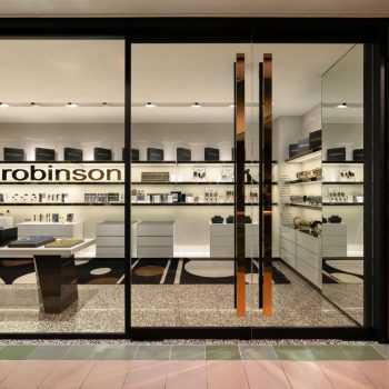 Store front showcasing glass doors and a visible sign that says "kimrobinson.